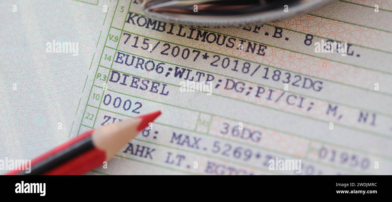a vehicle registration document with the words (Diesel, Euro 6) and a red pen Stock Photo Alamy