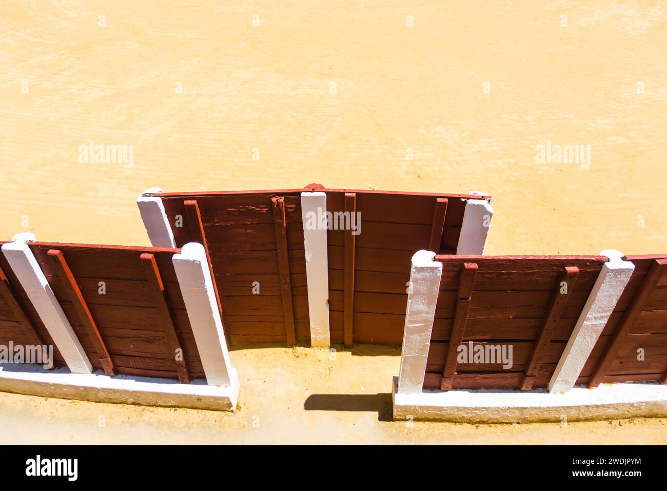 A top view of red fences on a sandy ground Stock Photo - Alamy