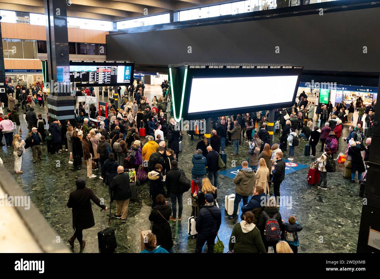 passengers-at-euston-station-london-following-train-delays-as-storm
