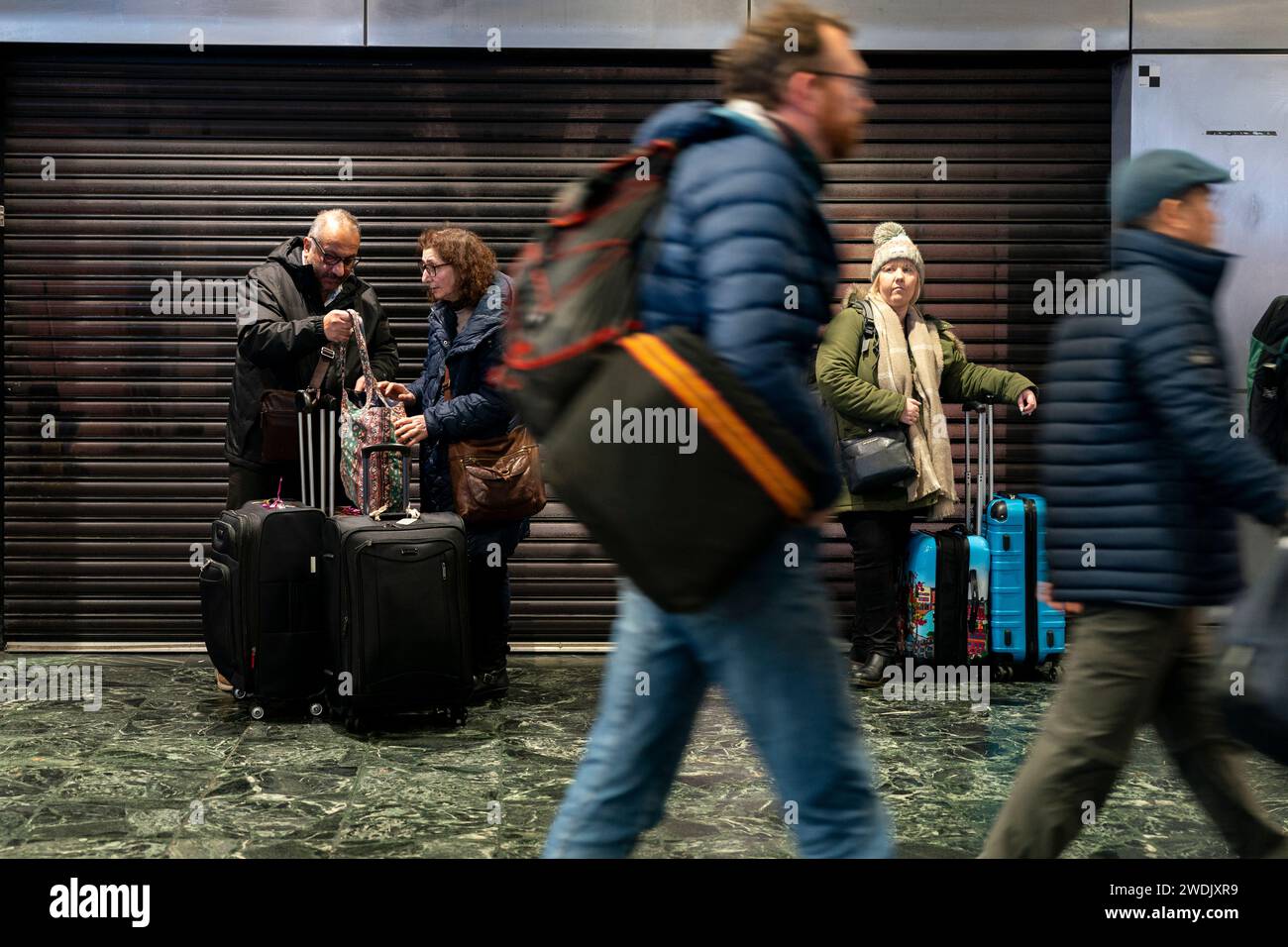 passengers-at-euston-station-london-following-train-delays-as-storm