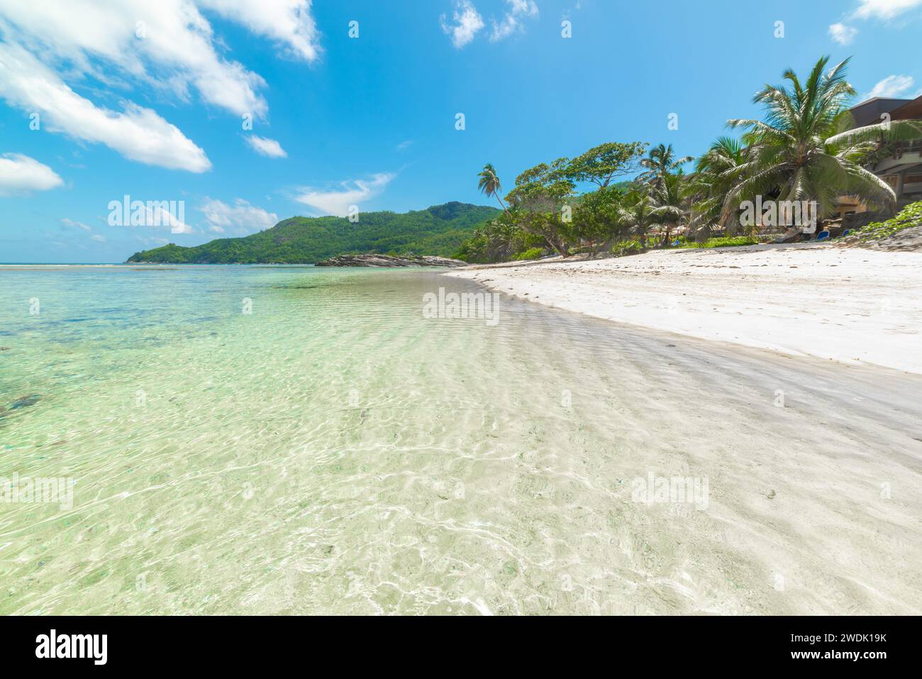 Anse Forbans under a blue sky with clouds. Mahe island, Seychelles Stock Photo