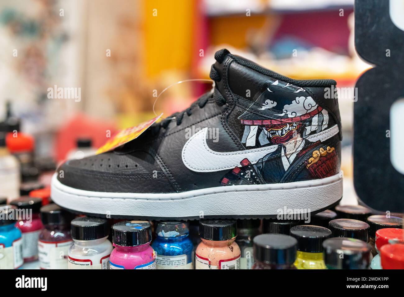 The art of painting shoes. A colorful Nike sneakers painted freshly