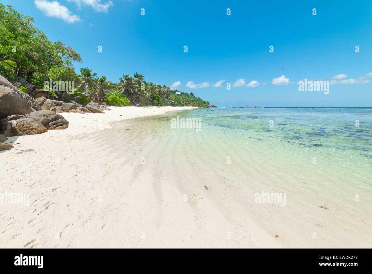 White sand and turquoise water in Anse Forbans beach. Mahe island, Seychelles Stock Photo