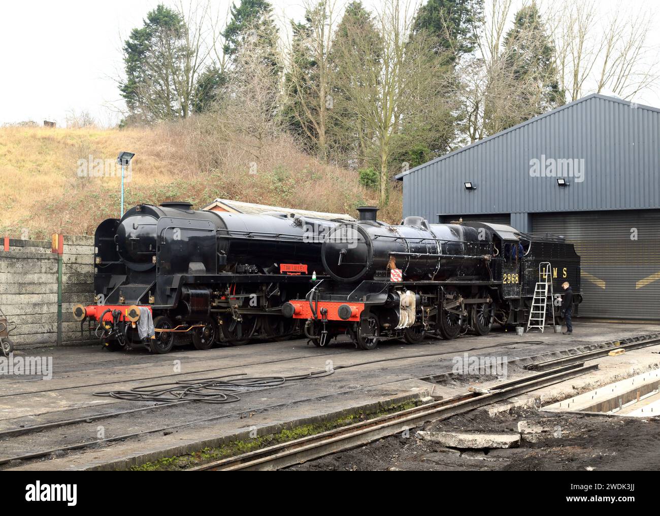 SR West country class 21C127 Taw valley and LMS Stanier mogul 42968 outside the engine sheds at Bridgnorth station on the Severn valley railway. Stock Photo