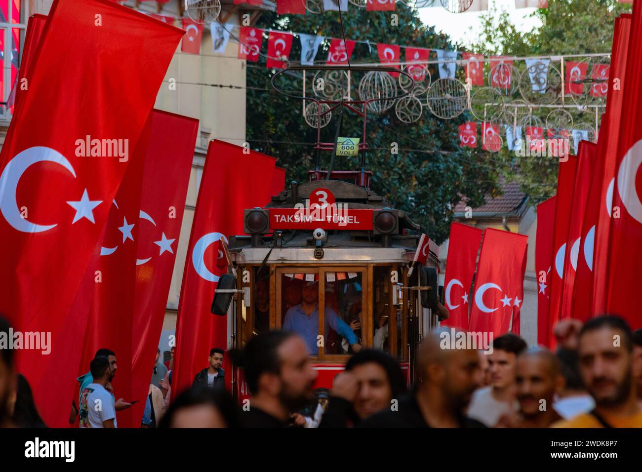 Istiklal Avenue view with people and Turkish flags. Istanbul Turkiye - 10.28.2023 Stock Photo