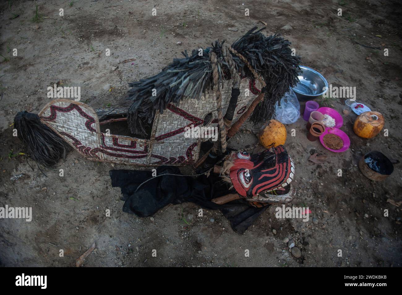 Rattan woven horses are seen while several Indigenous Javanese men act ...