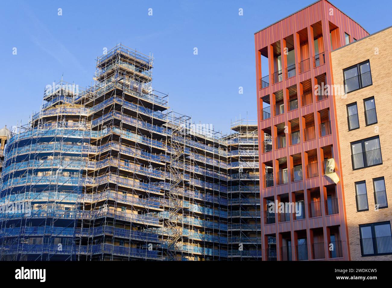 Scaffolding surrounding residential development for safe access to ...