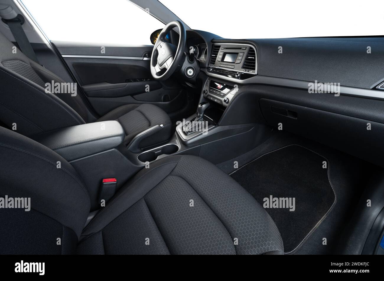 Car interior with cloth seats and isolated windows and dash panel Stock