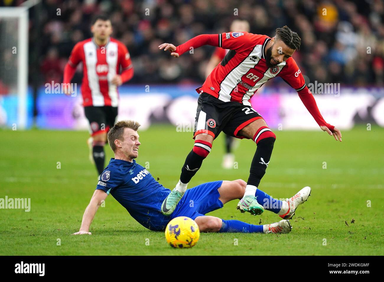 West Ham United's James Ward-Prowse challenges Sheffield United's Jayden Bogle during the Premier League match at Bramall Lane, Sheffield. Picture date: Sunday January 21, 2024. Stock Photo
