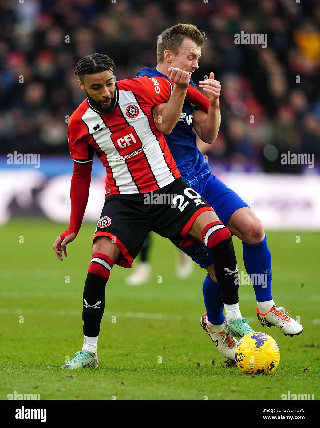 Sheffield United's Jayden Bogle (left) and West Ham United's James Ward-Prowse battle for the ball during the Premier League match at Bramall Lane, Sheffield. Picture date: Sunday January 21, 2024. Stock Photo