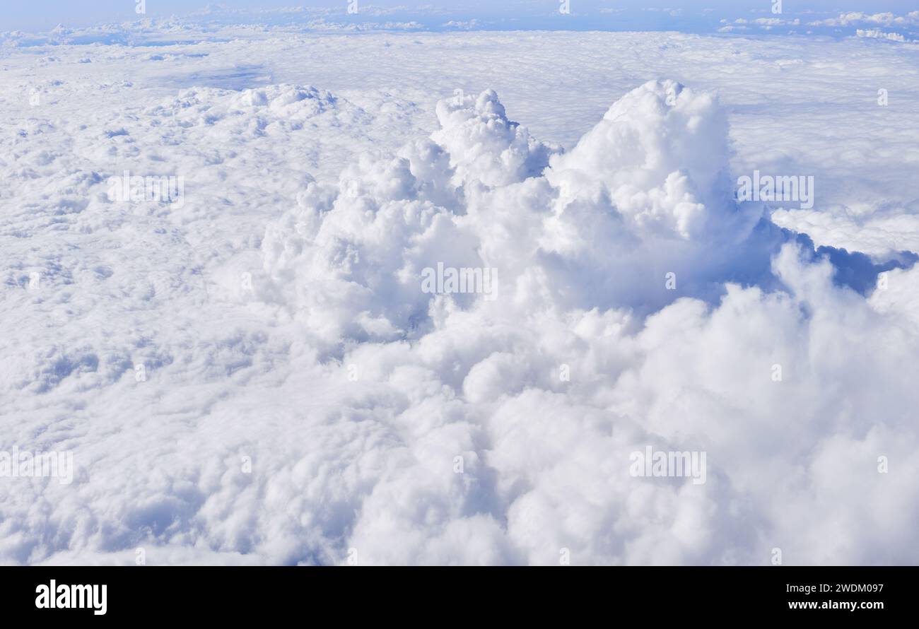 Aerial view of fluffy white cumulus clouds from above, symbolizing ...