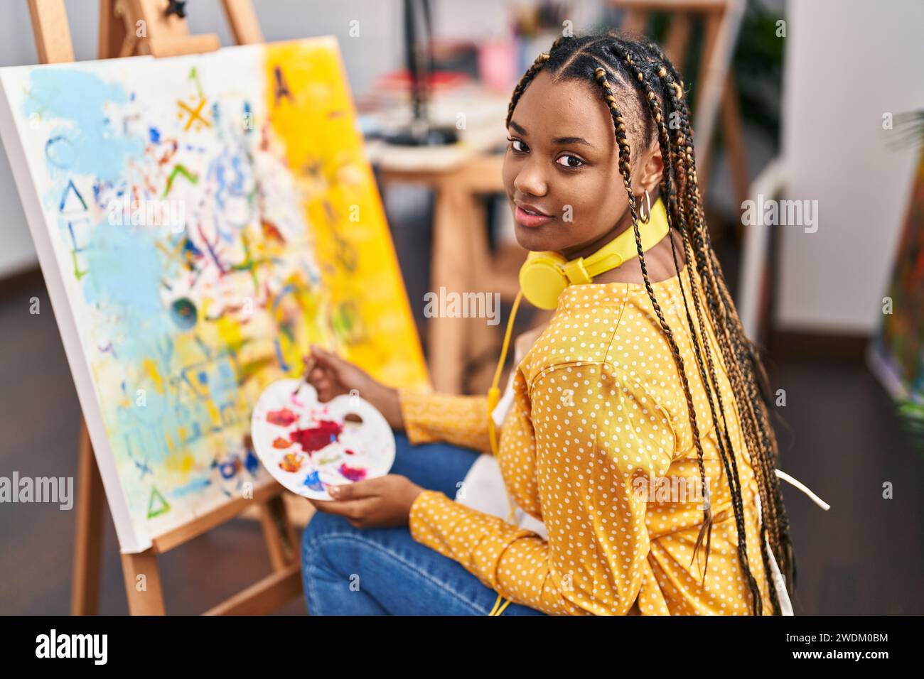 African american woman artist smiling confident drawing at art studio ...