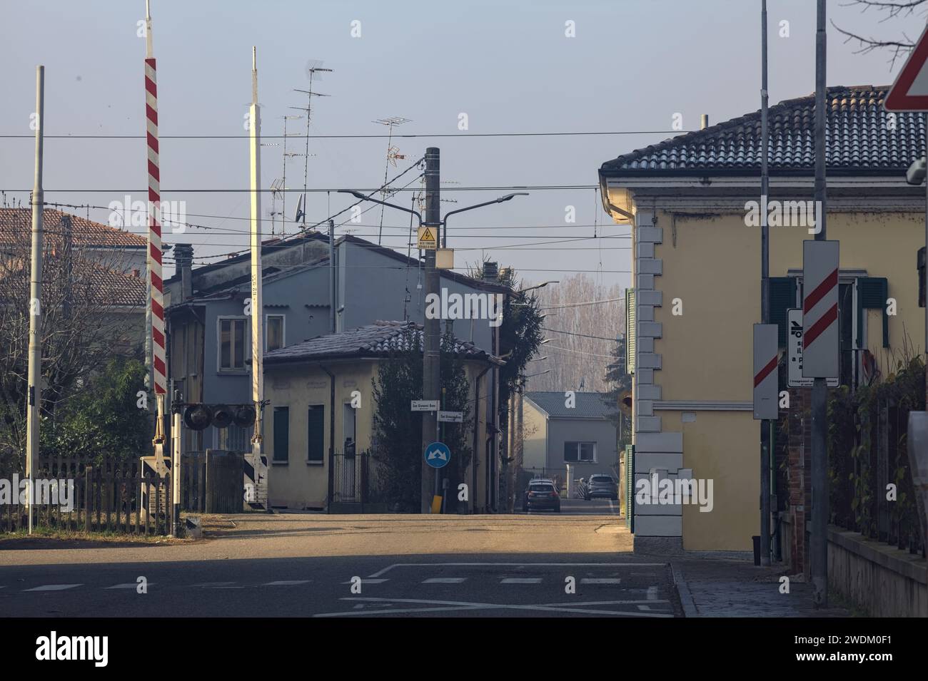 Railroad crossing in a village Stock Photo
