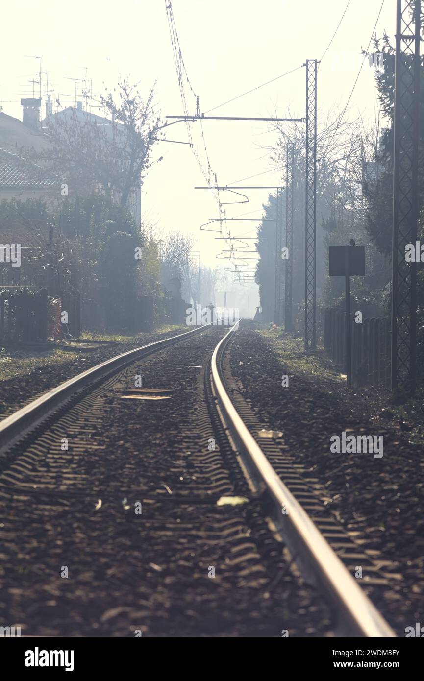 Railroad track passing through a village Stock Photo - Alamy