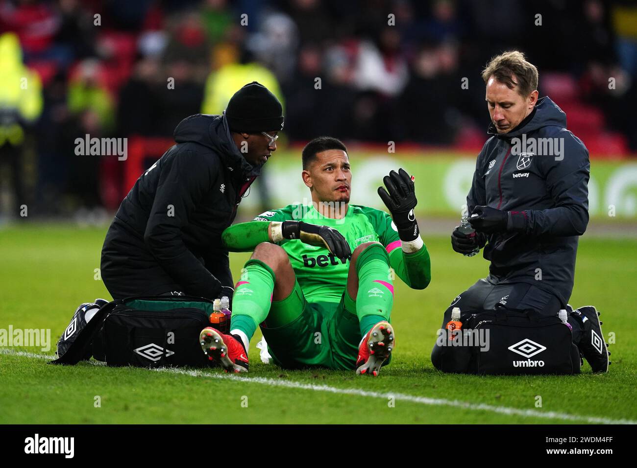 West Ham United goalkeeper Alphonse Areola receives treatment for an