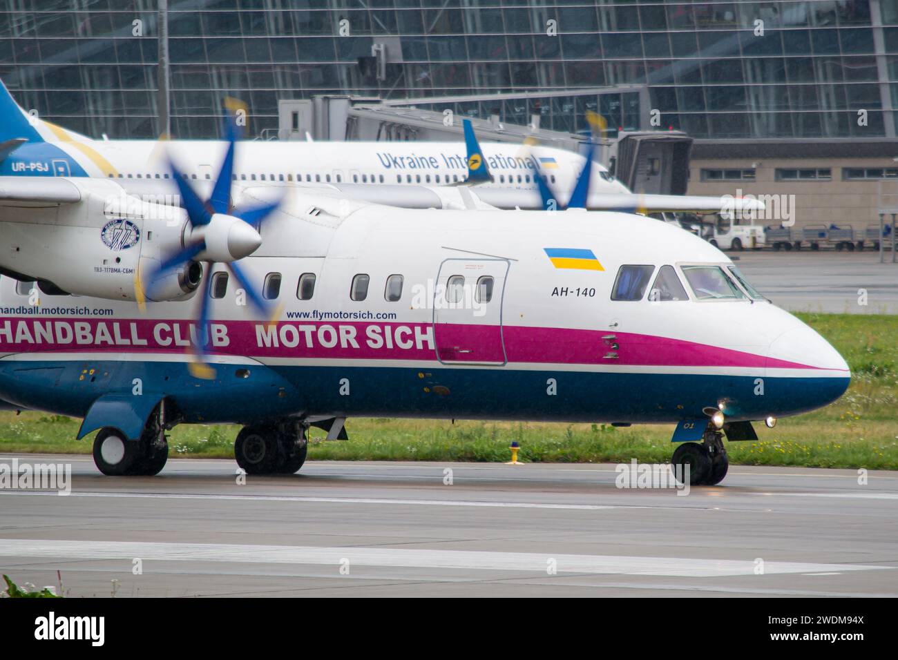 Motor Sich Antonov An-140 close-up while taxiing to gates after landing at Lviv after a flight from Kyiv Stock Photo