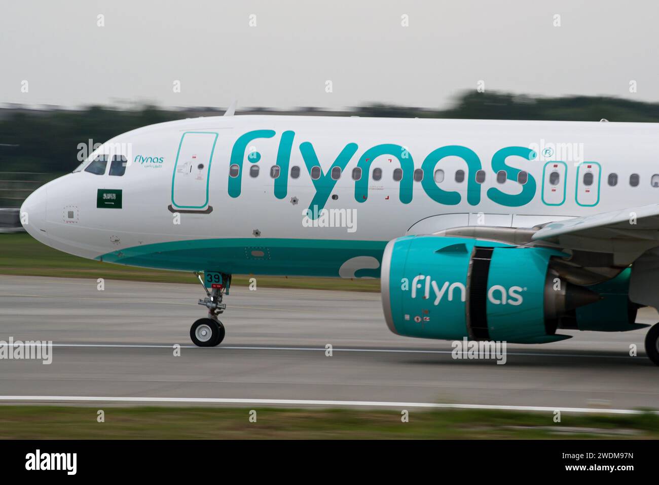 Saudi low-cost airline's Flynas Airbus A320 NEO close-up while slowing down after landing at Lviv, with reverse thrust on Stock Photo