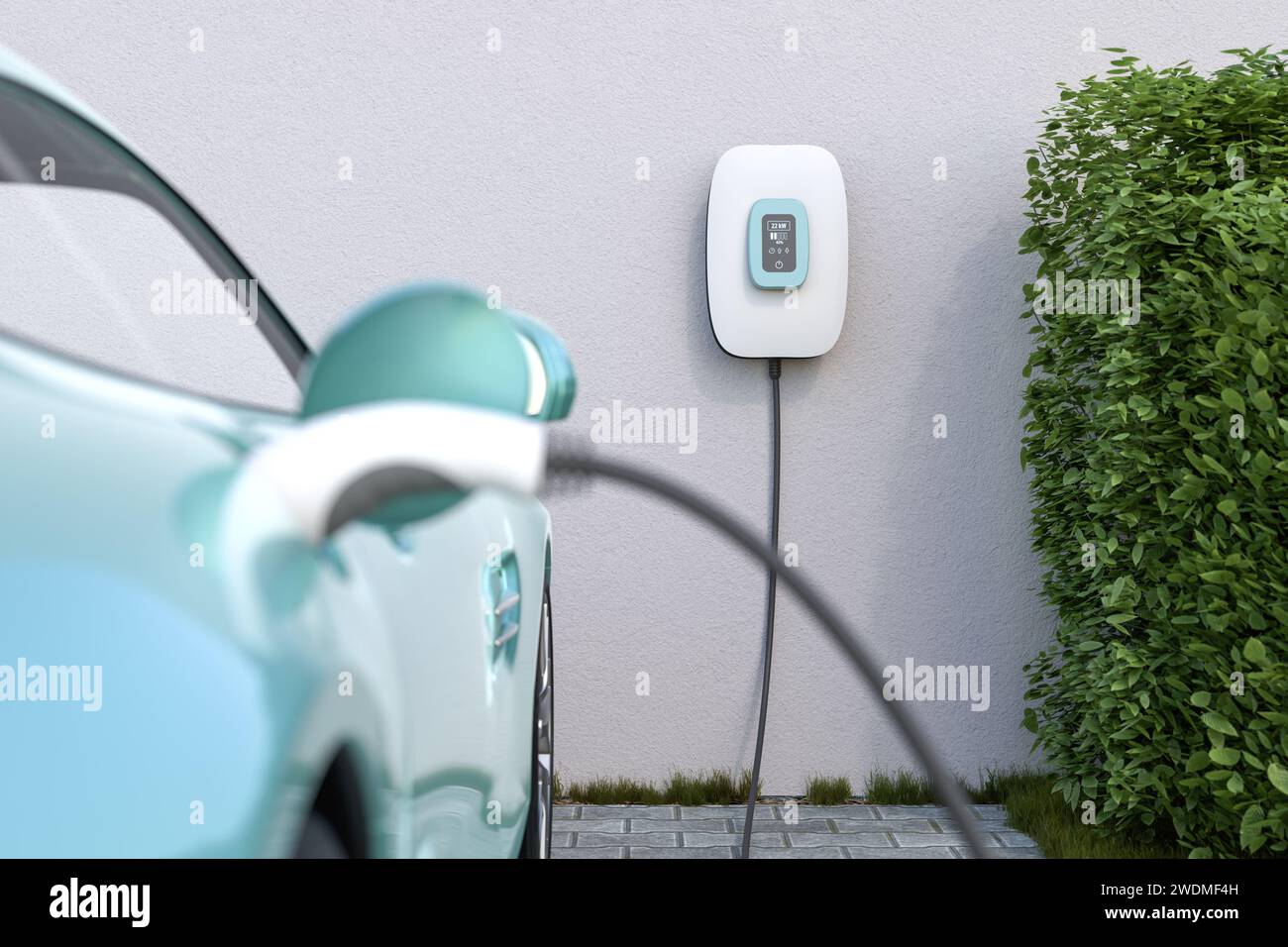 Charging an electric vehicle at home with a wallbox. Focus on the wallbox displaying status information. Selective focus. Stock Photo