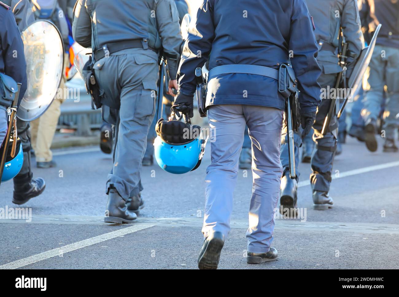 many policemen in uniform with riot gear during the protest ...