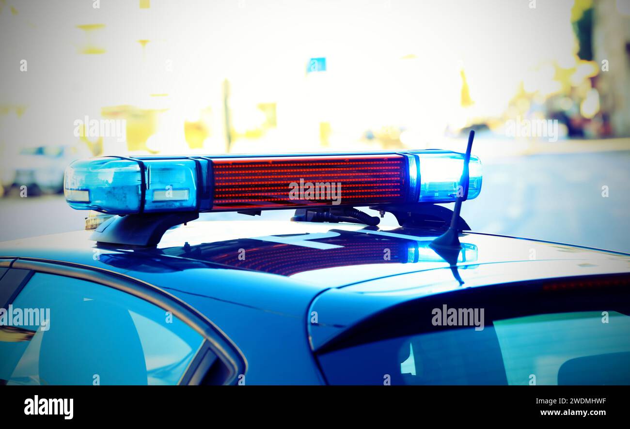 blue flashing siren on the police car during control Stock Photo - Alamy