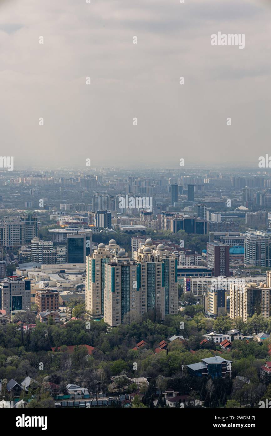 View of Almaty city, Republic of Kazakhstan, Central Asia. Cityscape at springtime, high-rise and low-rise buildings, residential buildings, offices a Stock Photo