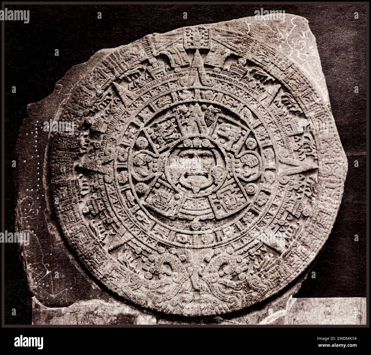Aztec Calendar Stone 1790 ca. 1885-ca. 1895 (photograph): Mexico City, Distrito Federal, Mexico Mexico Aztec albumen print Calendars Rock  reliefs (sculptures) museums (buildings)  interior views  Imaginary/Mythological creatures   The Aztec Calendar Stone, 'discovered in 1790, is a basaltic monolith. It weighs approximately 25 tons and is about 3.7 metres in diameter. In the Museo Nacional de Antropología, Mexico City.' (Source: Encyclopedia Britannica) Stock Photo