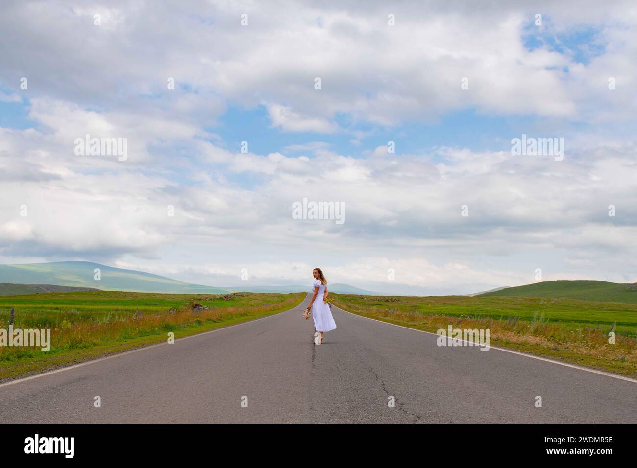 Girl in blue dress walks hi-res stock photography and images - Alamy