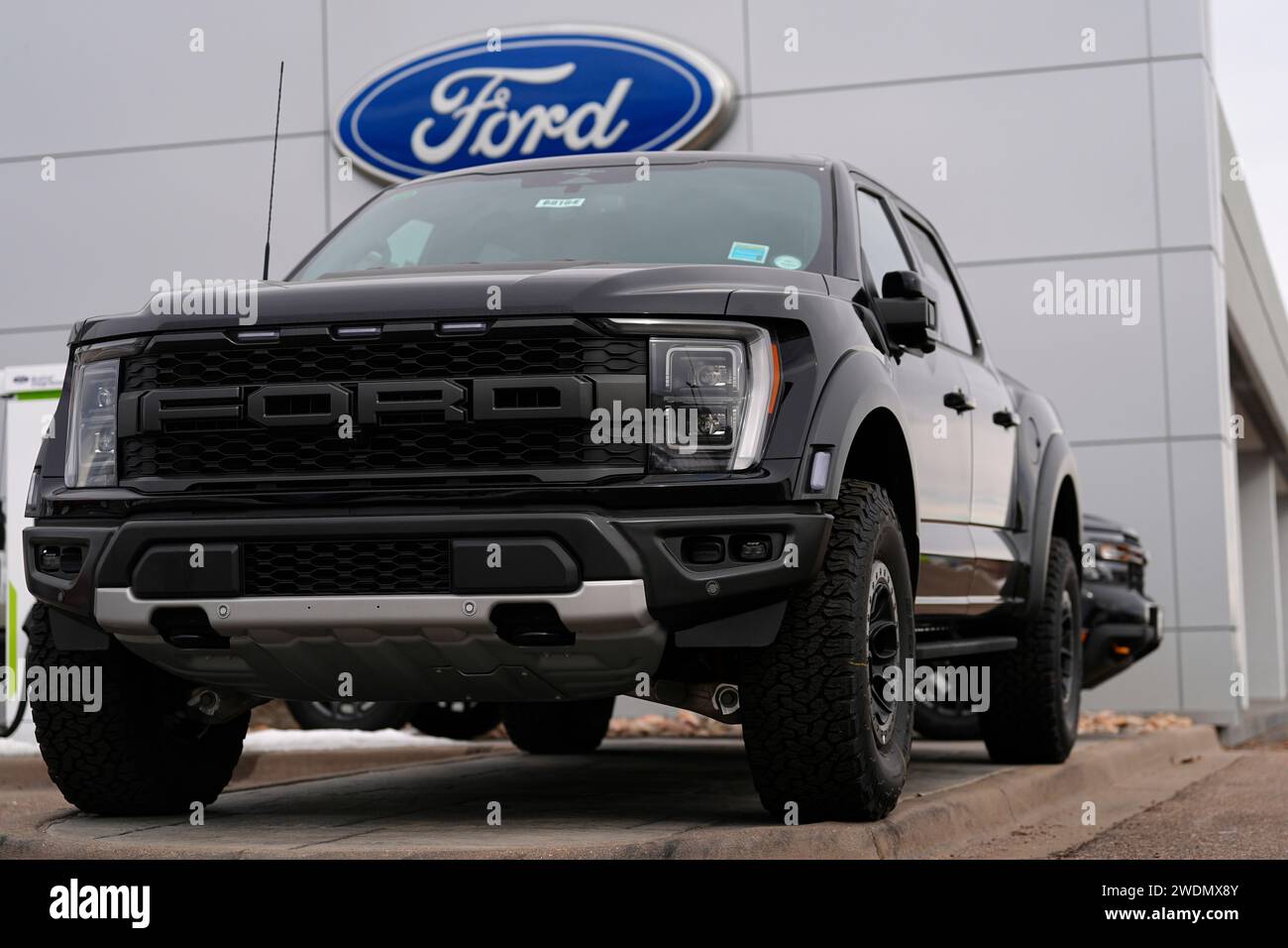 Unsold 2024 F150 Lightning Raptor pickup truck sits at a Ford