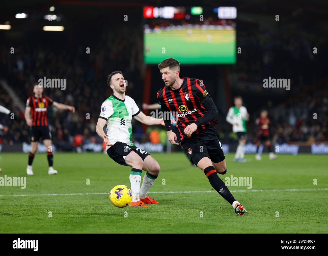Vitality Stadium, Boscombe, Dorset, UK. 21st Jan, 2024. Premier League Football, AFC Bournemouth versus Liverpool; Chris Mepham of Bournemouth takes control of the ball from Diogo Jota of Liverpool in the penalty area Credit: Action Plus Sports/Alamy Live News Stock Photo