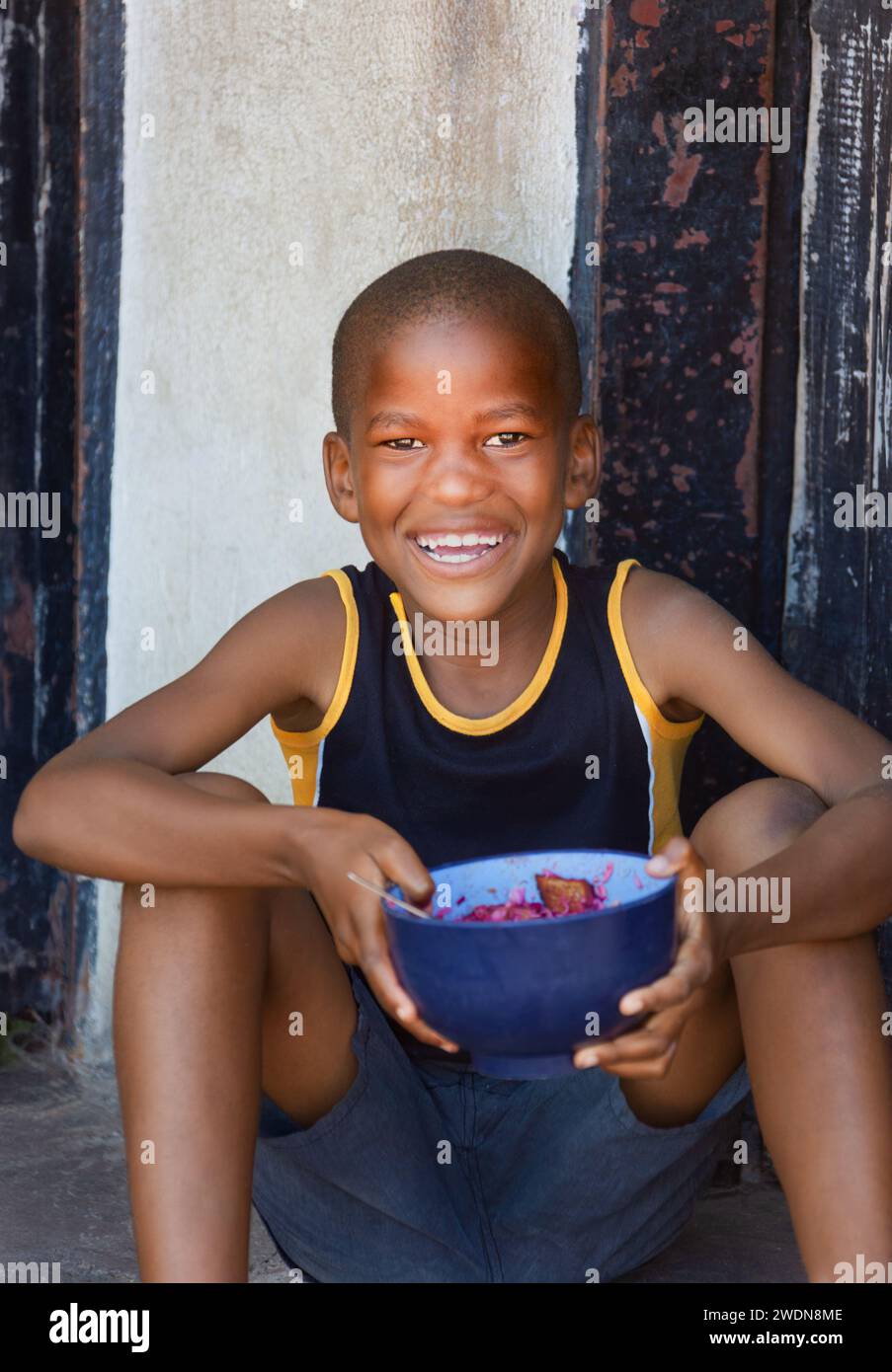 hungry africanhungry african child, charity and volunteers feeding the hungry Stock Photo