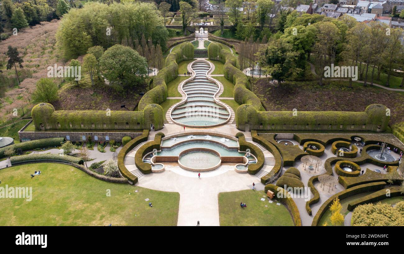 The Alnwick gardens from above filled with people and trees Stock Photo ...