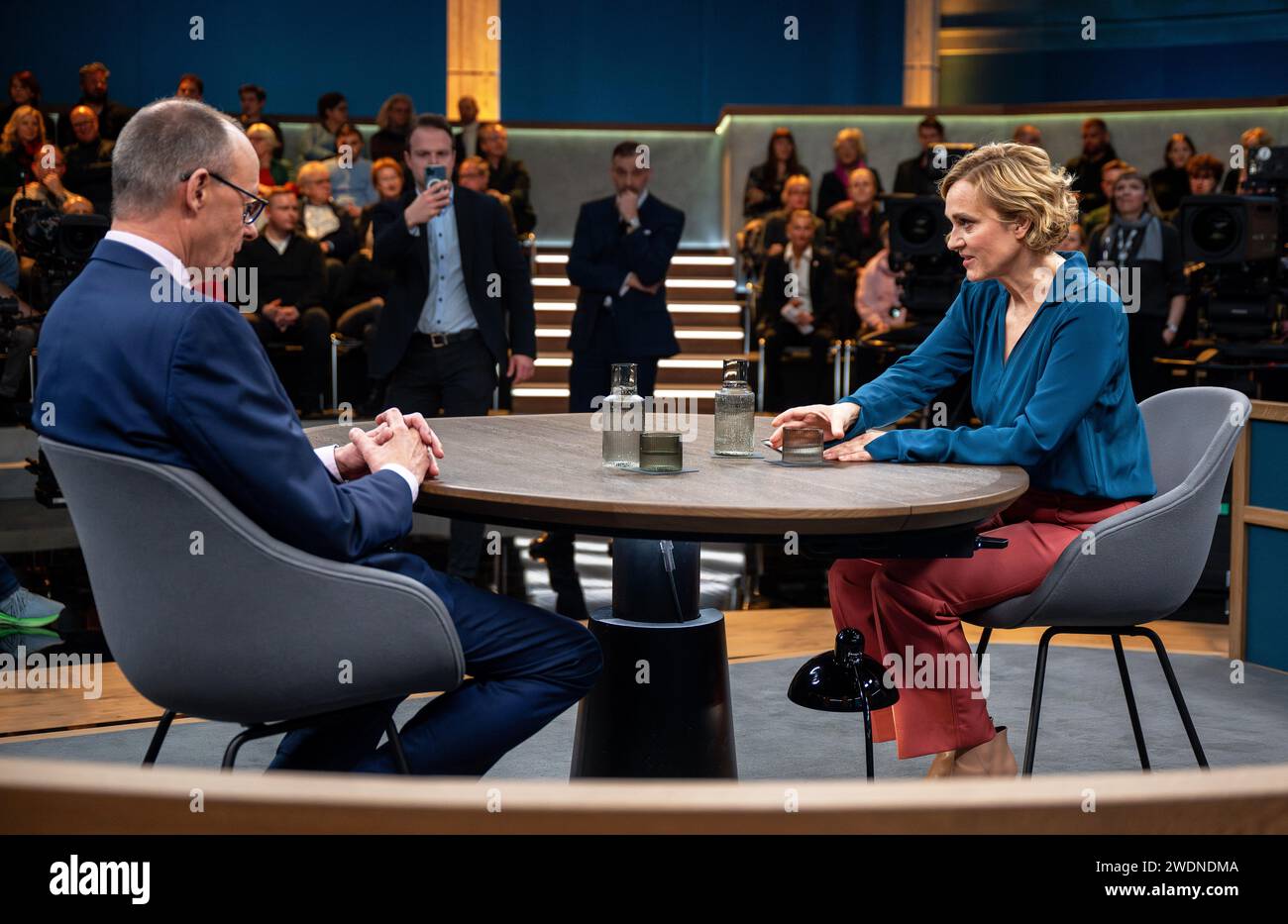 Berlin, Germany. 21st Jan, 2024. Caren Miosga (r), presenter, talks to