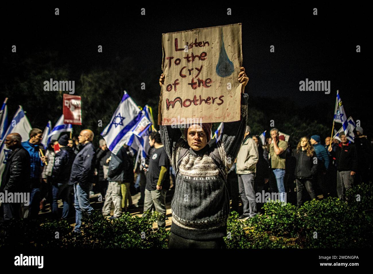A man holds a placard during a protest outside the home of Prime Minister Benjamin Netanyahu. The US, Egypt and Qatar are pushing Israel and Hamas to accept a comprehensive plan that would end the war, see the release of hostages held in Gaza, and ultimately lead to full normalization for Israel with its neighbors and talks for the establishment of a Palestinian state, The Wall Street Journal reported on Sunday. Stock Photo
