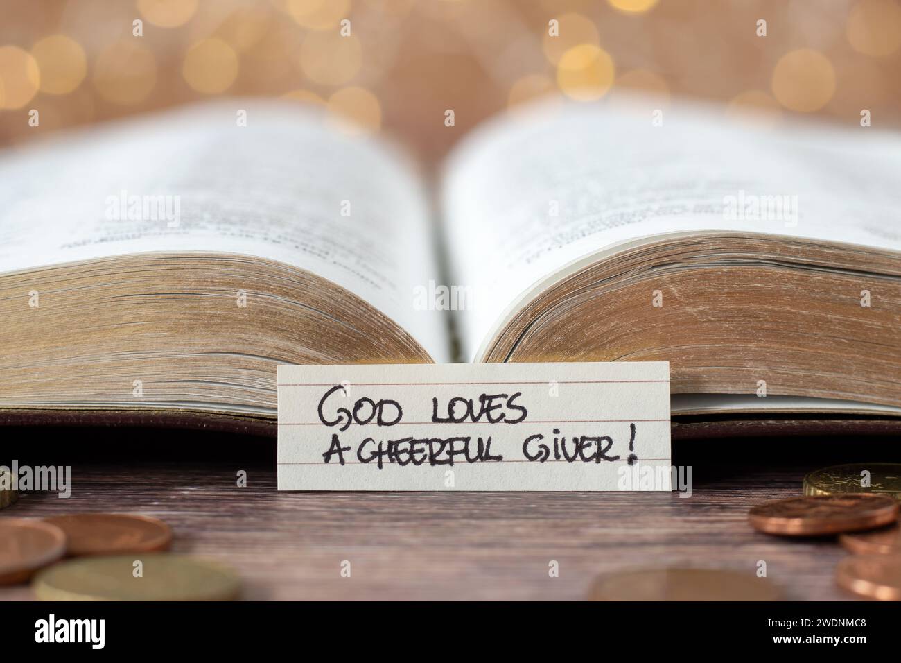 God loves a cheerful giver, handwritten text note in front of open holy