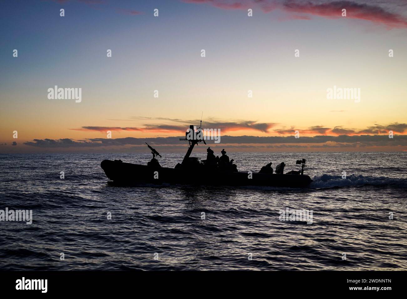 Marines assigned to Battalion Landing Team (BLT) 1/5, 15th Marine Expeditionary Unit (MEU), operate an 11-meter rigid inflatable boat while conducting visit, board, search and seizure training with the amphibious dock landing ship USS Harpers Ferry (LSD 4), while underway in the Pacific Ocean, Jan. 14, 2024. The Boxer Amphibious Ready Group, comprised of USS Boxer (LHD 4), USS Somerset (LPD 25), and Harpers Ferry, and the embarked 15th MEU are underway conducting integrated training and routine operations in U.S. 3rd Fleet. (U.S. Navy photo by Mass Communication Specialist 2nd Class Sang Kim) Stock Photo