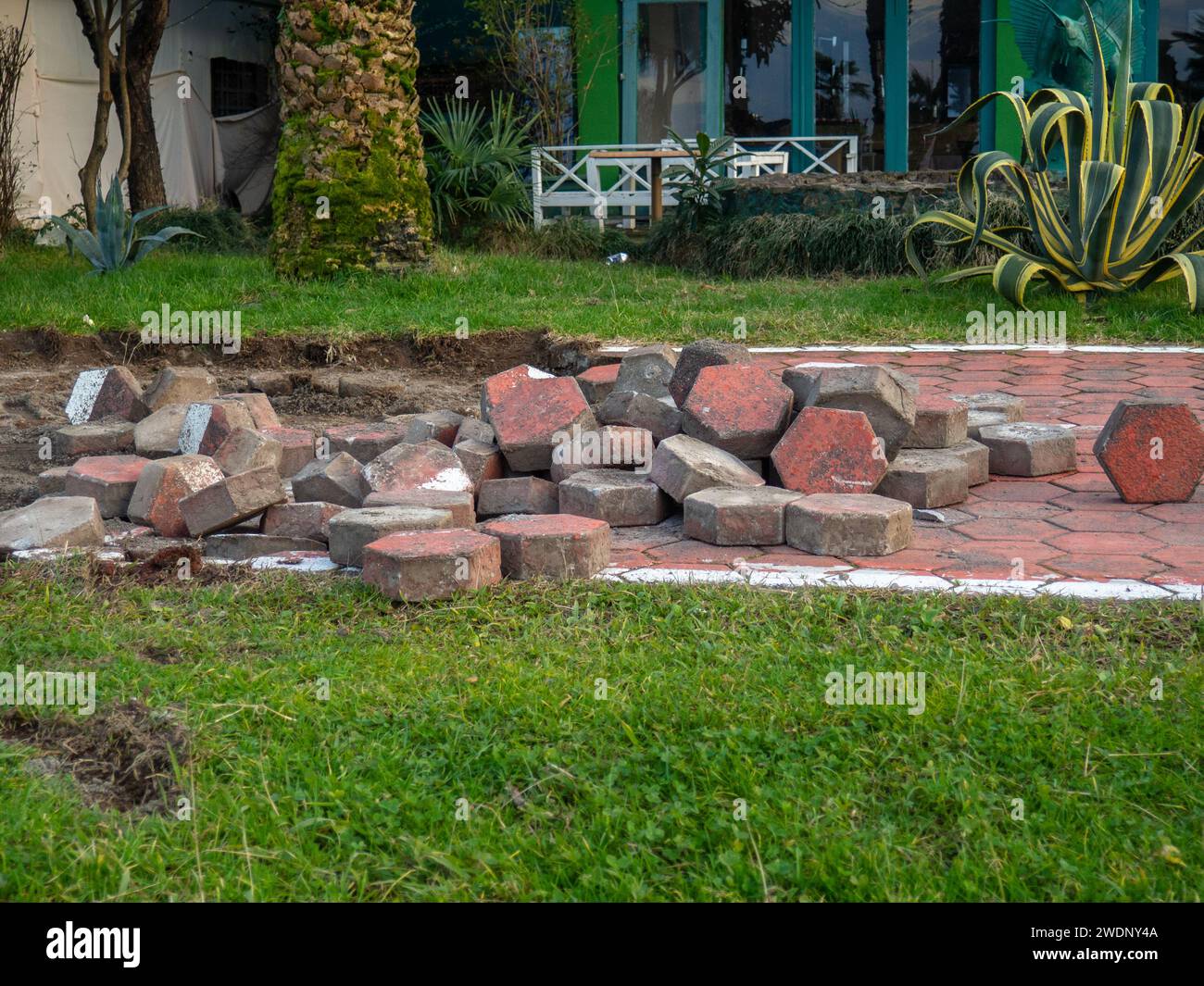 Reconstruction of the bike path. Replacing tiles on a bike path among ...