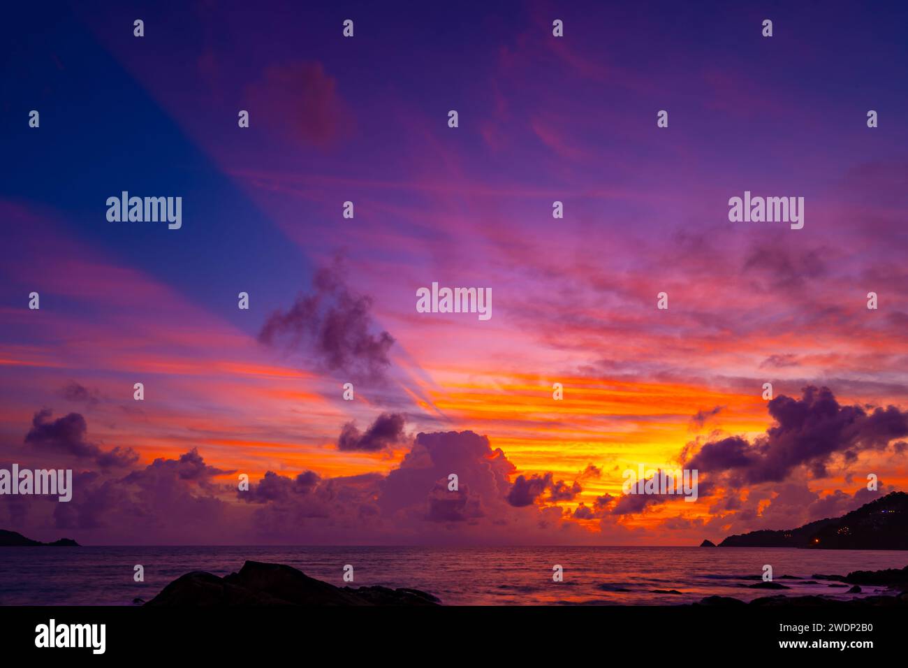 Beautiful colorful sunset or sunrise sky over sea with dramatic clouds ...