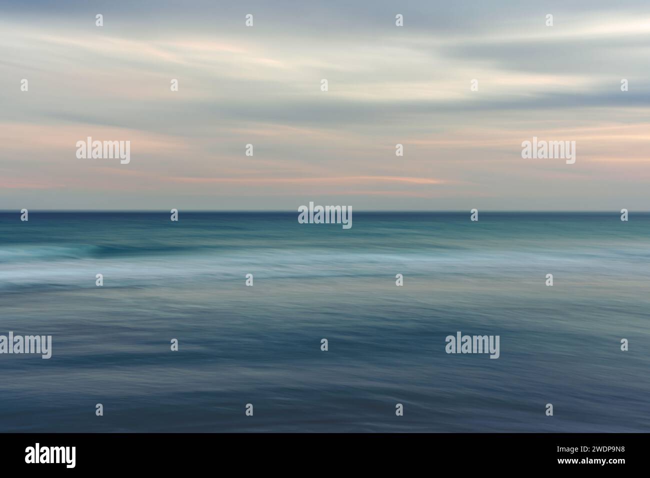 Ocean and cloudy sky, abstract background, motion blur. Stock Photo