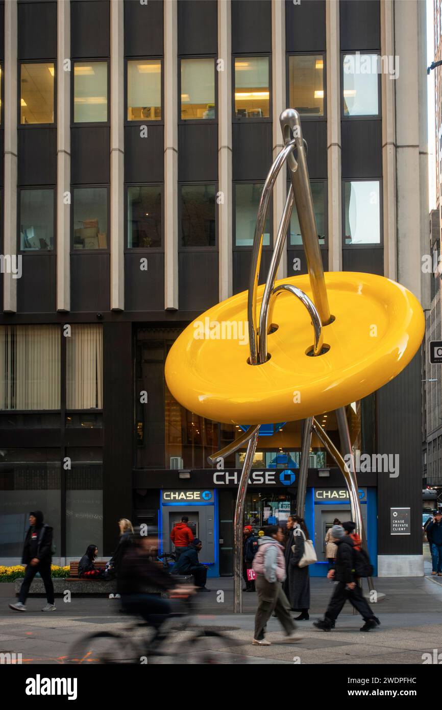giant needle and button sculpture in the garment district in Manhattan NYC Stock Photo