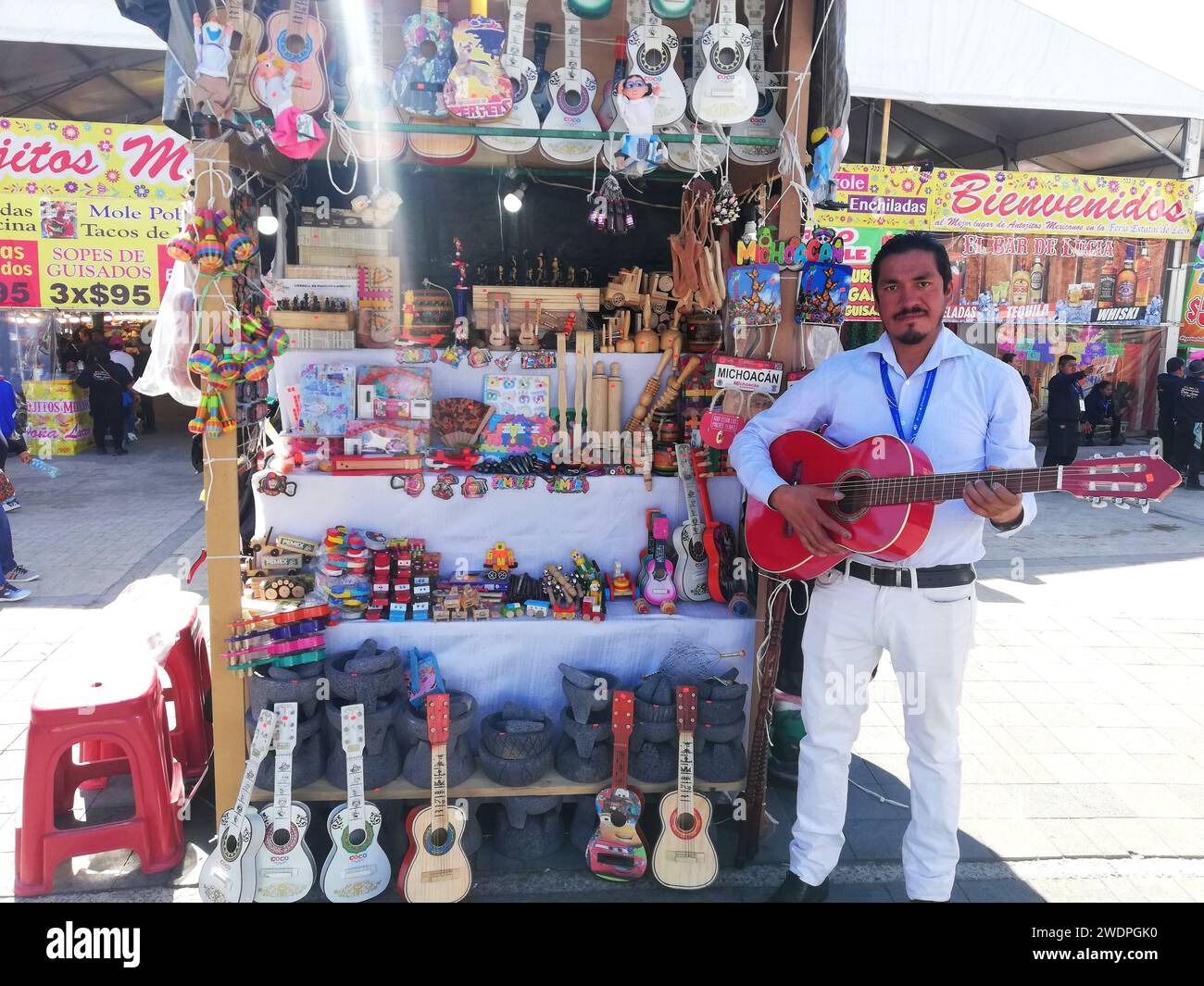 LEON, MEXICO. JAN 21. (EDITORIAL USE ONLY) Master artisian Ignacio Hernandez plays handmade guitar from Paracho, Michoacan during Guanajuato State fair at Feria de Leon 2024 on Jan 21, 2024 in Leon, Mexico. Photo by JVMODEL Credit: JVMODEL/Alamy Live News Stock Photo
