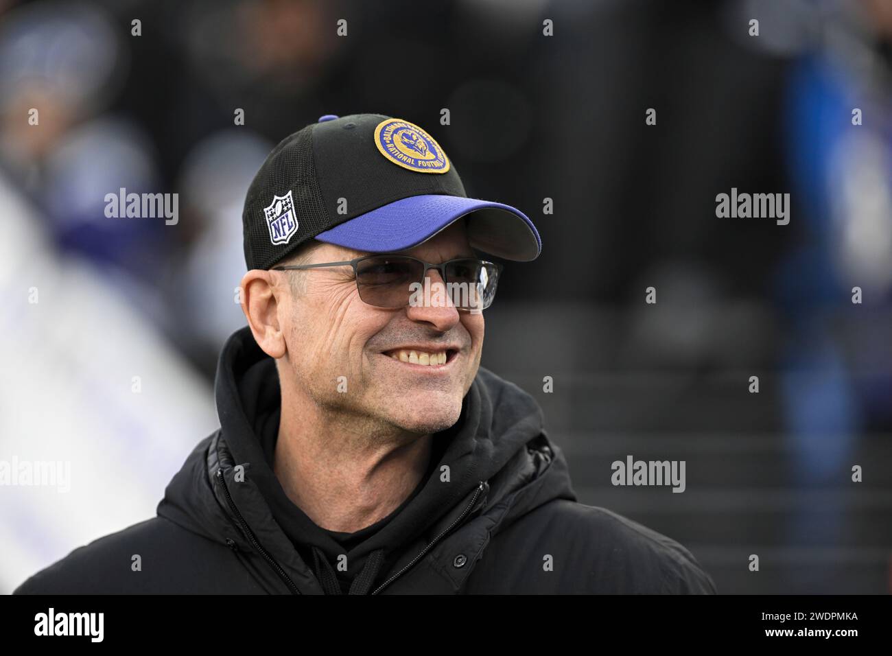 University of Michigan head football coach Jim Harbaugh looks on before