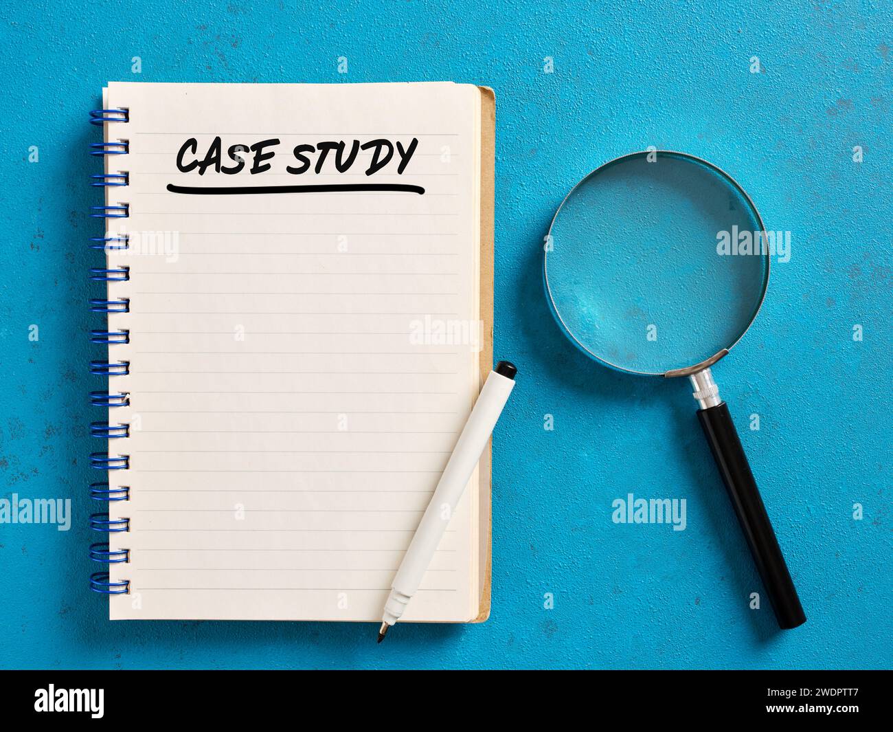 The word case study handwritten an a notebook with a magnifying glass. Business and education concept. Stock Photo