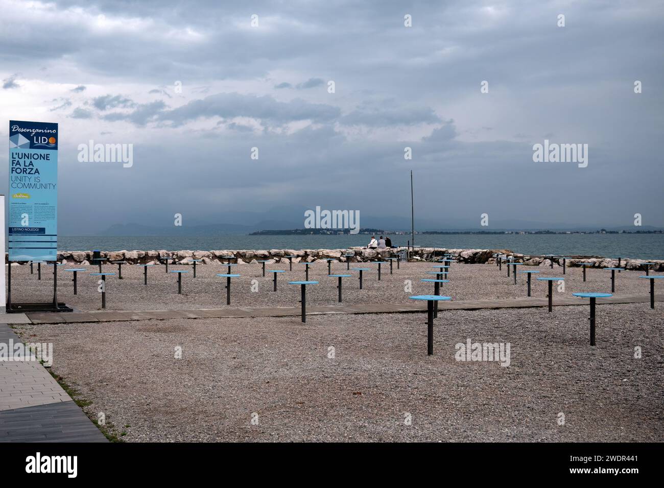 DESENZANO DEL GARDA, ITALY - SEPTEMBER 22, 2023:  Community area on the beach with sign Stock Photo