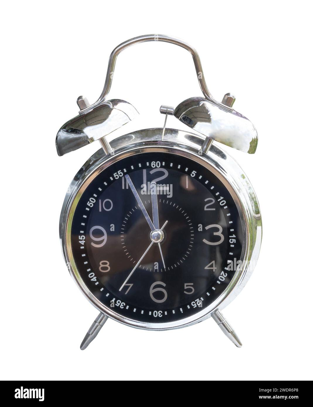 Black and silver alarm clock is isolated on white background with clipping path. 12 o'clock noon and lunch time reminder. Time concept Stock Photo