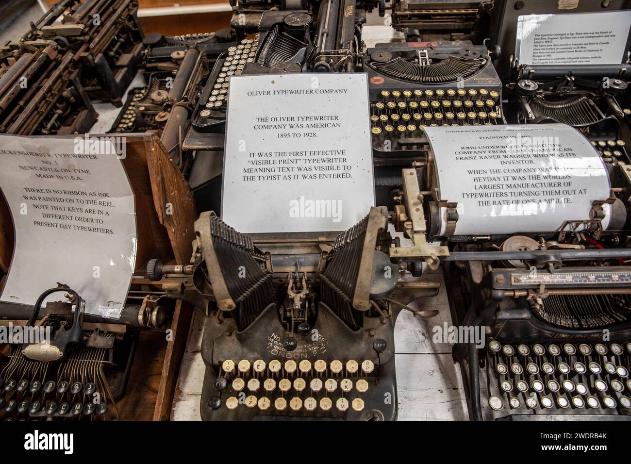 Vintage typewriters Left to right, Blickensderfer No5, Oliver typewriter, Underwood and Stott typewriter, behind Remington and corona, museum display Stock Photo