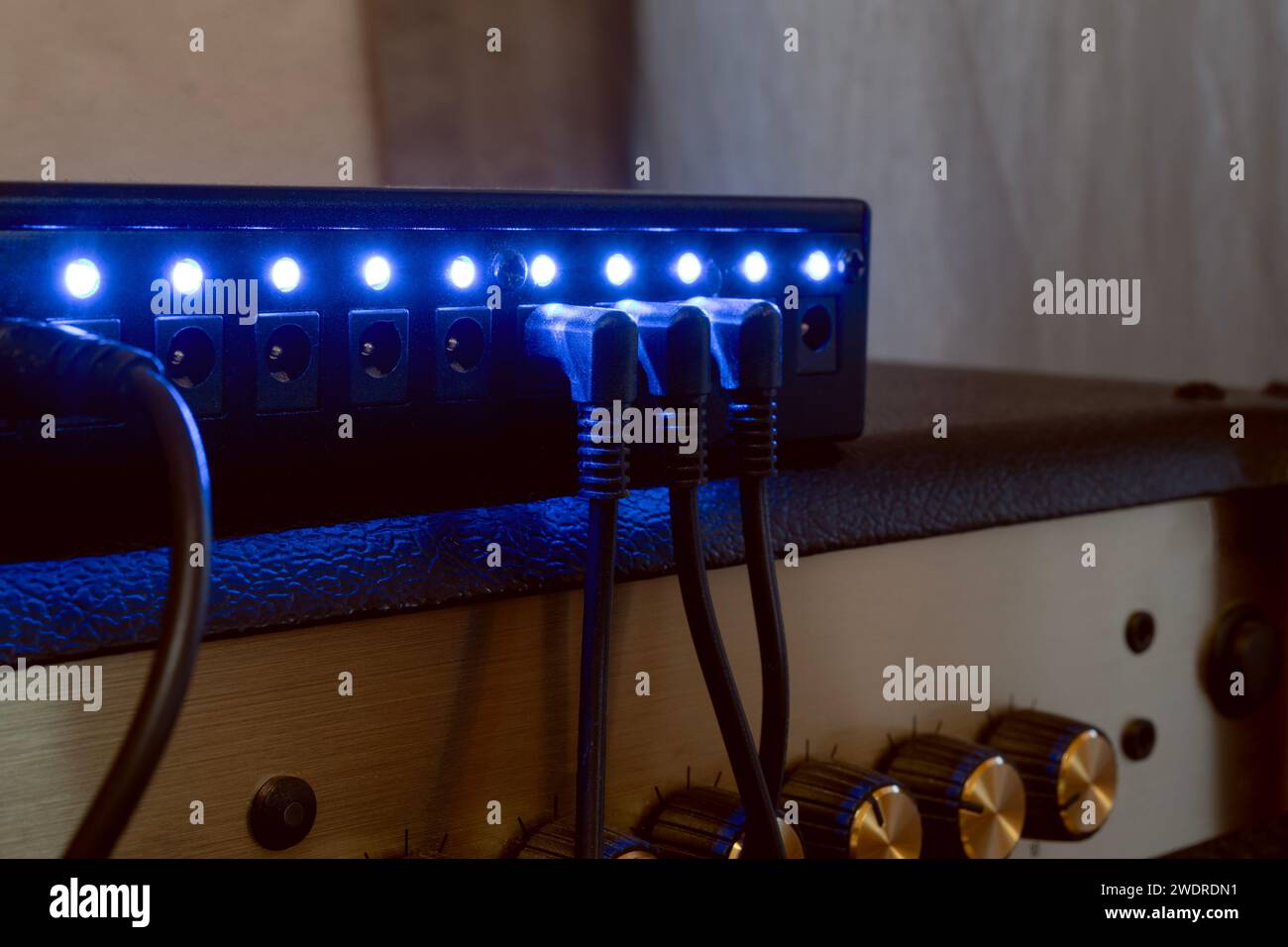 Multiple 9 volt power supply for guitar pedals sitting on an amplifier