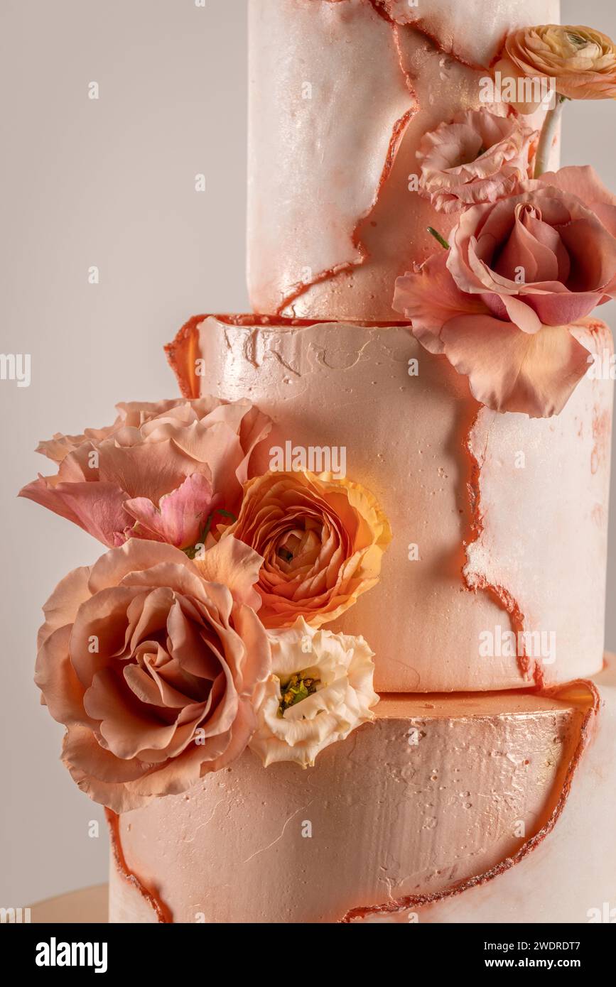 Simple wedding cake with flowers, close up Stock Photo