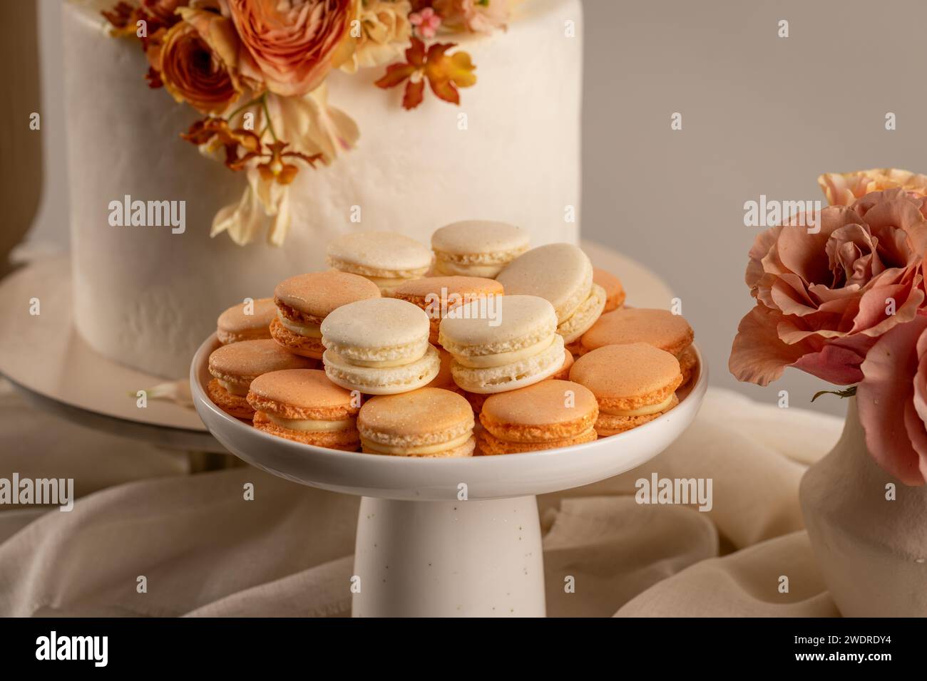 Sweet pastel colored macarons on festive table Stock Photo