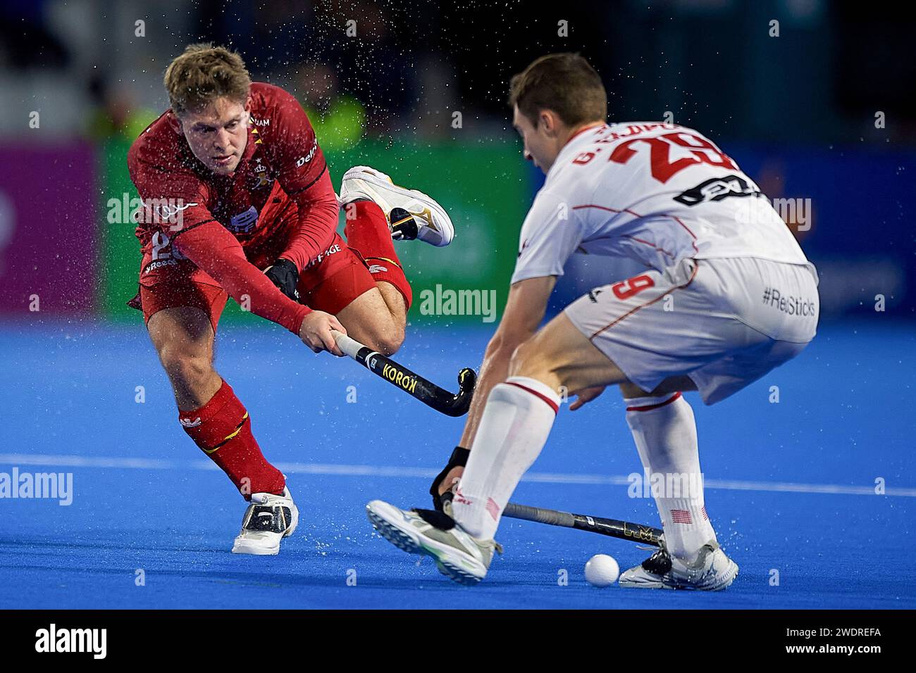 Valencia, Spain. 21st Jan, 2024. Gerard Clapes (R) of Spain vies with Victor Wegnez of Belgium during a Men's Hockey Olympic qualifiers 2024 match in Valencia, Spain, Jan. 21, 2024. Credit: Pablo Morano/Xinhua/Alamy Live News Stock Photo