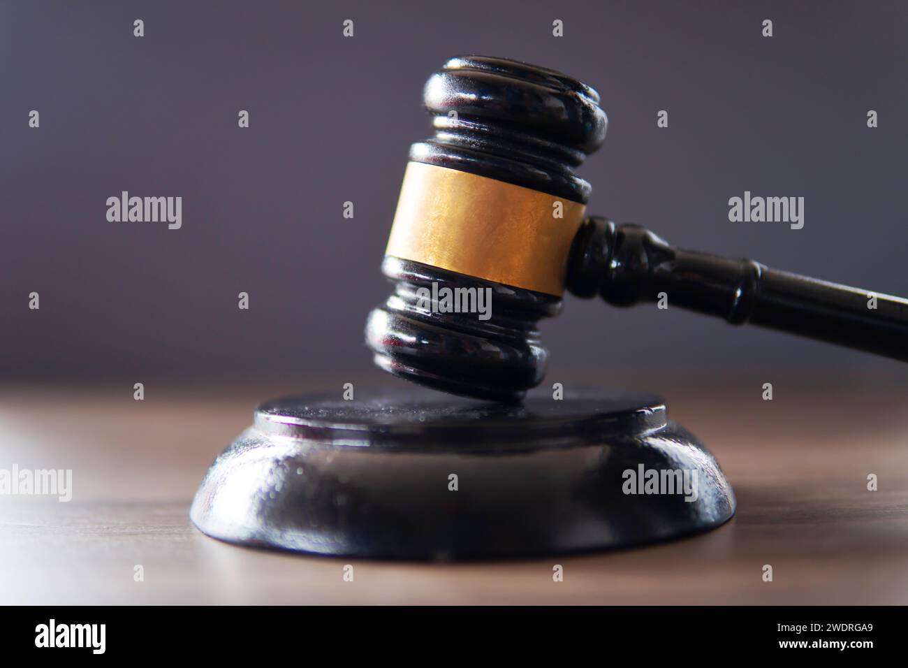 Closeup image of judge gavel on dark background. Law and justice concept. Stock Photo